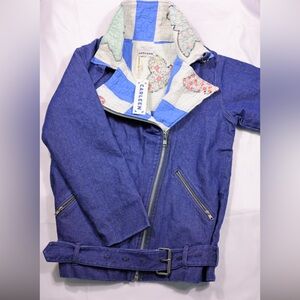 This is a Free People Carleen Moto Jacket in a dark rinse denim.